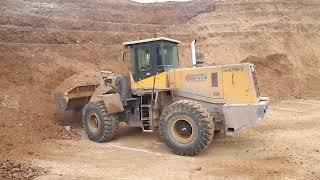 An Iranian wheel loader loading Mercedes Benz LK 2624 which were imported into Iran in 1982