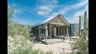 Comfortabele lodge met combimagnetron In Bloemendaal aan zee - Belvilla Vakantiehuis