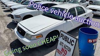 Selling a ton of police cars at auction