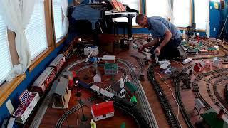 Model trains leaving a very old train shed !