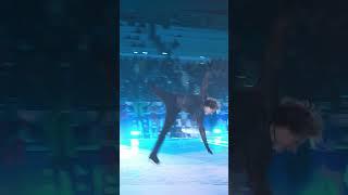 Ilia Malinin jumps his Quad Axel under the Olympic Rings