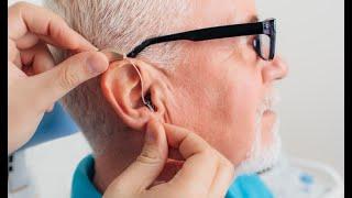 How do I put my open fit hearing aids in