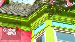 Montreal officials see red after century-old home turned into colourful billboard