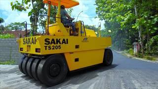 Paving Asphalt On The Narrow Road