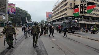 See Tired Kenya Police officers after 5 hours of trying to contain protestors in vain in Nairobi