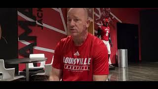 Louisville head coach Jeff Brohm visits with Cardinal Authority's Michael McCammon