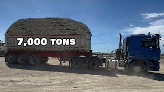 Trucks offloading 7,000 tons of sand and gravel onto the barge / S6: E9 barge