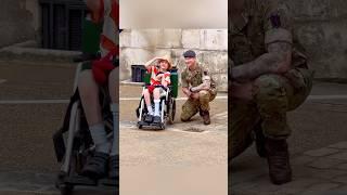 Touching moment with king’s guard and disabled child