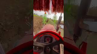 Mahindra Arjun Tractor with heavy plough in farm