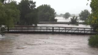 Flood Waters Crest the Banks of the South St Vrain in Longmont, CO