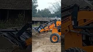 JCB machine working leveling mud