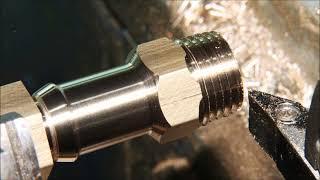 Cnc lathe makes Hose Barb for A series classic mini engine. Turned, drilled, thread cut and parted