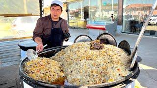 Popular Uzbek pilaf in a large kazan I National Uzbek food