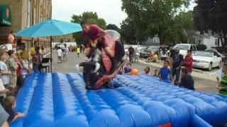 ride a bull at the outdoor fun festival at the church