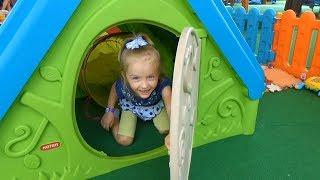 Polina plays on the outdoor playground