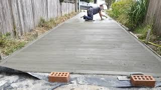 Hand finishing concrete driveway