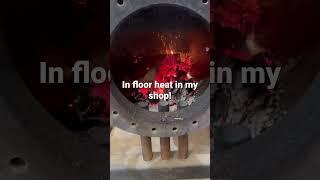 home made wood stove boiler for shop heat. Heated concrete floor