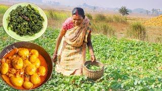 Santali tribe grandmaa collect Potato Shak for cooking shak vaji and Mutton fat potato curry