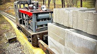 Homemade miniature locomotive pulling a 1.5t load up a 2.5 per cent incline at idle!