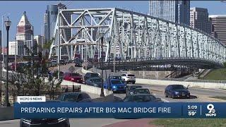 Crews begin the work to repair Daniel Carter Beard Bridge after fire