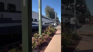 Caltrain Bombardier cabcar 113 leaving Burlingame with F40PH-2 CAT 916 trailing.