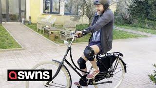 Man who received world's first double arm transplant rides bike for the first time | SWNS