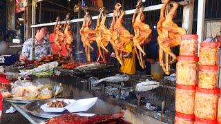 A very busy food selling! Grilled chicken,duck, fish and more pickled