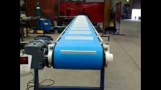 Cleated belt conveyors