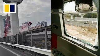 Construction crane falls onto moving train in Shanghai