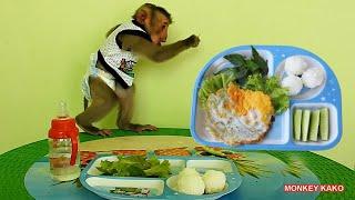 Baby Monkey Kako Have Lunch With Fried Egg And Vegetables