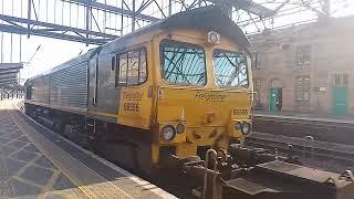 4M30 Freightliner class 66 556 departing Carlisle platform 4 with 5 tone and containers to Daventry