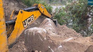 Boulders Packed Mountain Excavation for New Rural Village Mountain Road