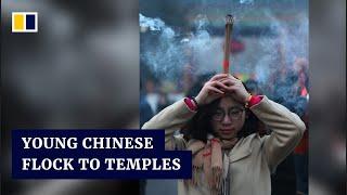 Growing number of young people in China flock to religious temples to escape life’s pressures