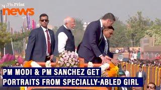 A specially-abled girl presented portraits of PM Modi and PM Pedro Sanchez during their roadshow