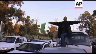 Pro-Gadhafi supporters "celebrating" on streets of Tripoli