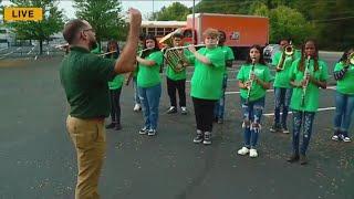 Arsenal Tech Titan Band performs outside the studio