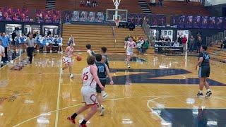 Shakamak guard Jaden Johnson with a block vs Marshall