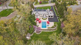 Step into European elegance on Tenafly's prestigious East Hill with this limestone-built estate!