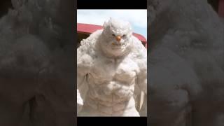 Muscle man fights snowman on the beach