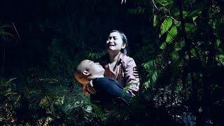 in the forest, dark night, scared: the girl goes, looking for her husband and his condition