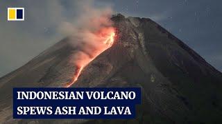 Indonesian volcano Mount Merapi erupts, forcing tourists to flee clouds of ash