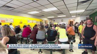 Customers pack "M & M Red Hots" on reopening day in Elmira