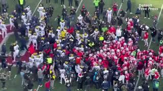 Michigan vs. Ohio State football: Players try to plant Michigan flag on OSU logo at midfield