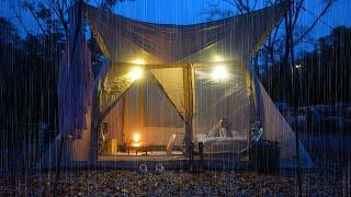 Camping alone in the rain in a small, cozy air tent under a maple tree that rains all day