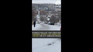 Parked police car creates domino effect as vehicles crash on icy Oregon road