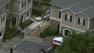 Car flips, crashes into Norcross apartment complex