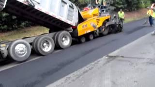 Transfer of asphalt from the truck to the road