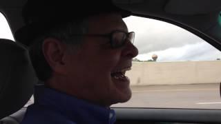 Rich Neubert Smiling and Driving