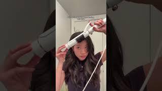 styling curtain bangs with a curling iron 