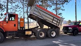 International 7600 dump truck selling at John Peck Auctions